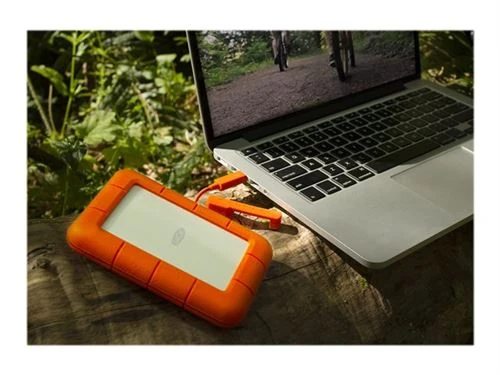 Sauvegarde de données informatiques — disque dur externe LaCie Rugged connecté à un ordinateur portable — conseils CAM-IT pour protéger vos fichiers, photos et documents importants